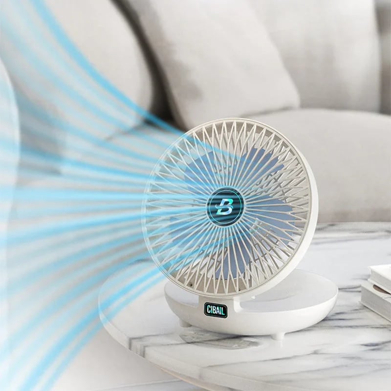 A white fan with a blue light on a white marble surface with a white sofa in the background