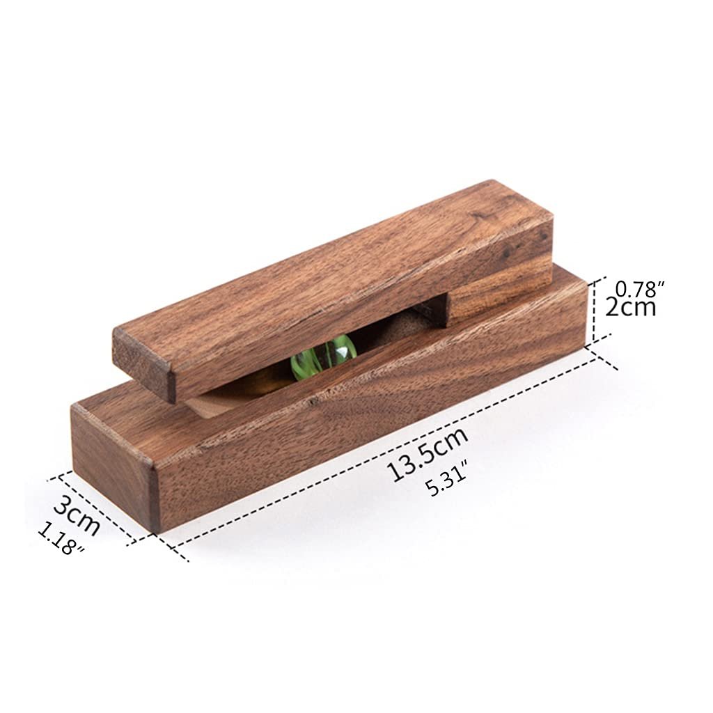 Three walnut towel holders mounted on a bathroom wall holding white towels