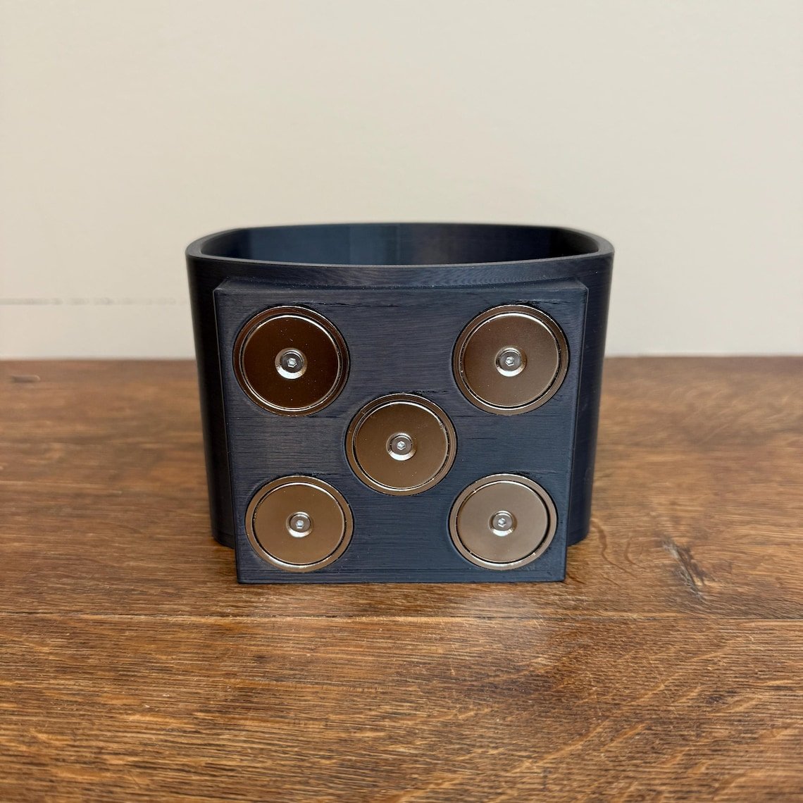 May include: A black plastic container with six silver magnets on the front. The magnets are arranged in a 2x3 grid. May include: A black plastic container with six silver magnets on the front. The magnets are arranged in a 2x3 grid.